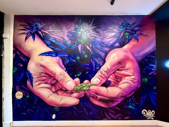 Detailed hands mural painted by Miami mural artist DREPS