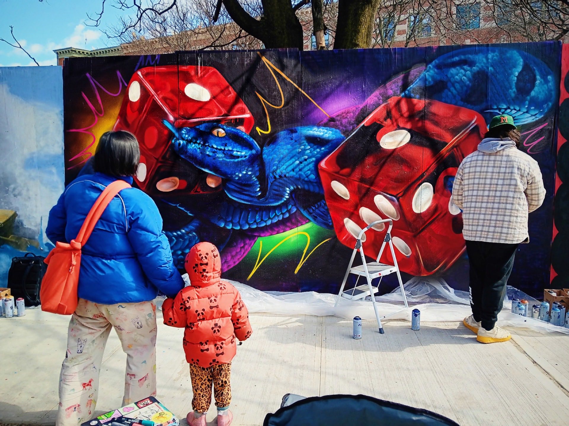 DREPS live painting a mural at a Miami festival