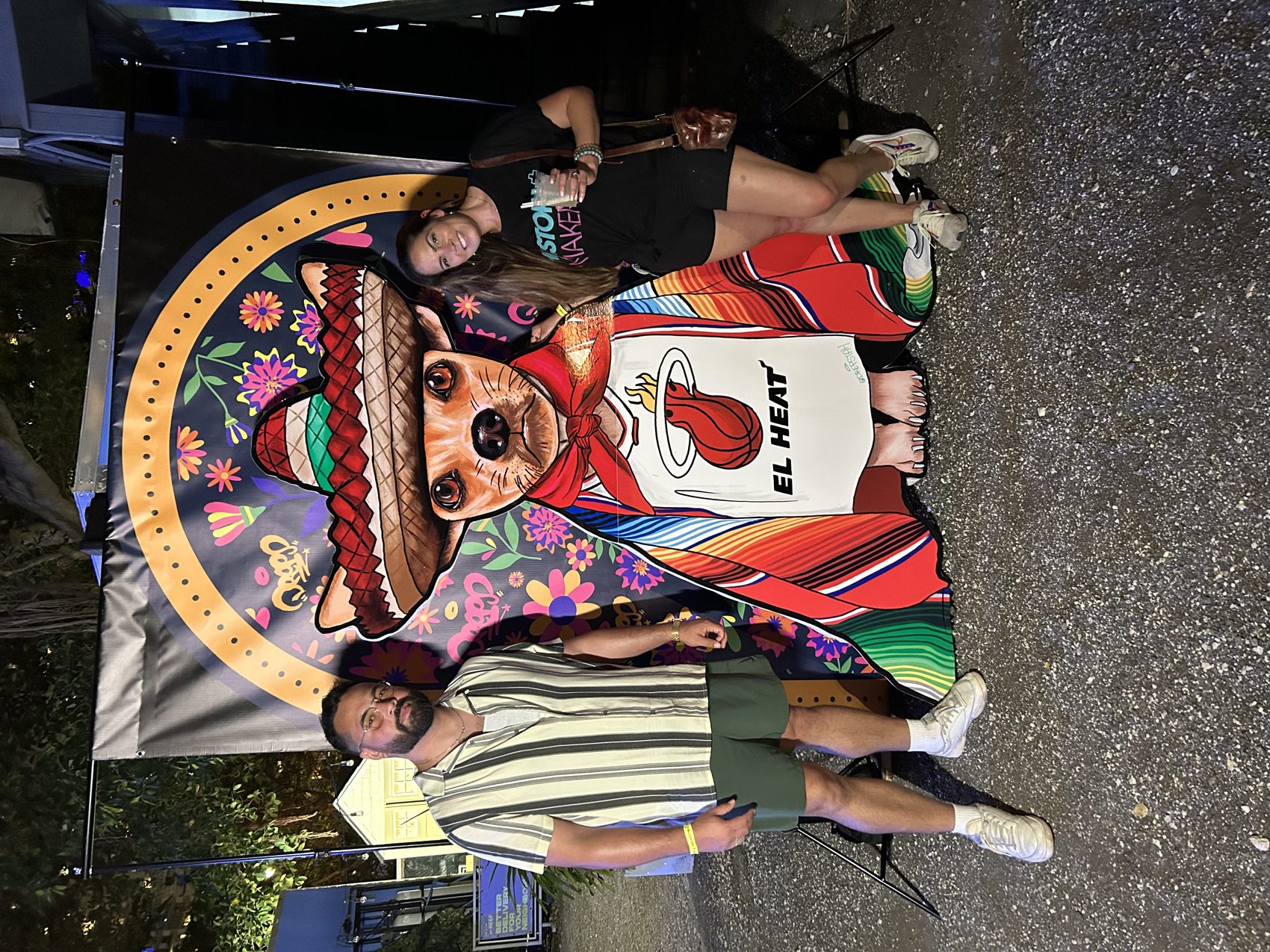 Fans with El Heat mascot cutout