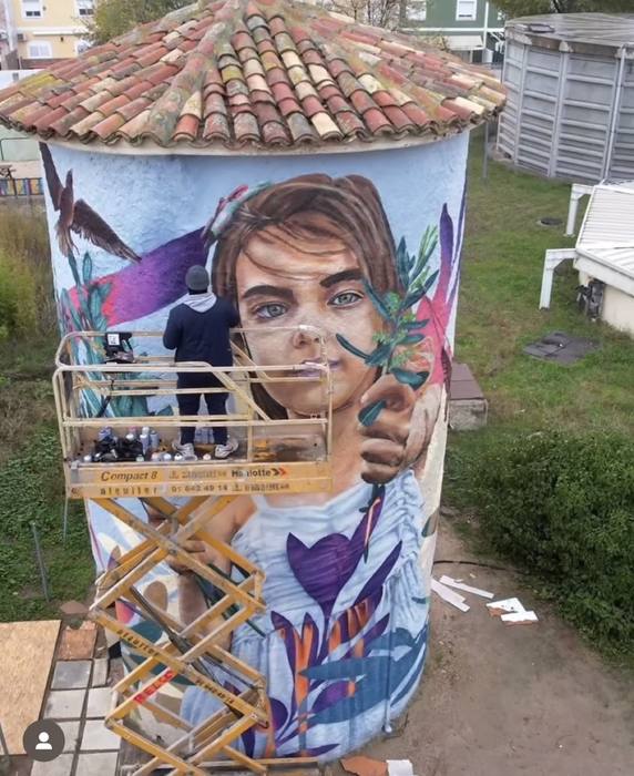 Large-scale silo mural painted by Miami mural artist DREPS